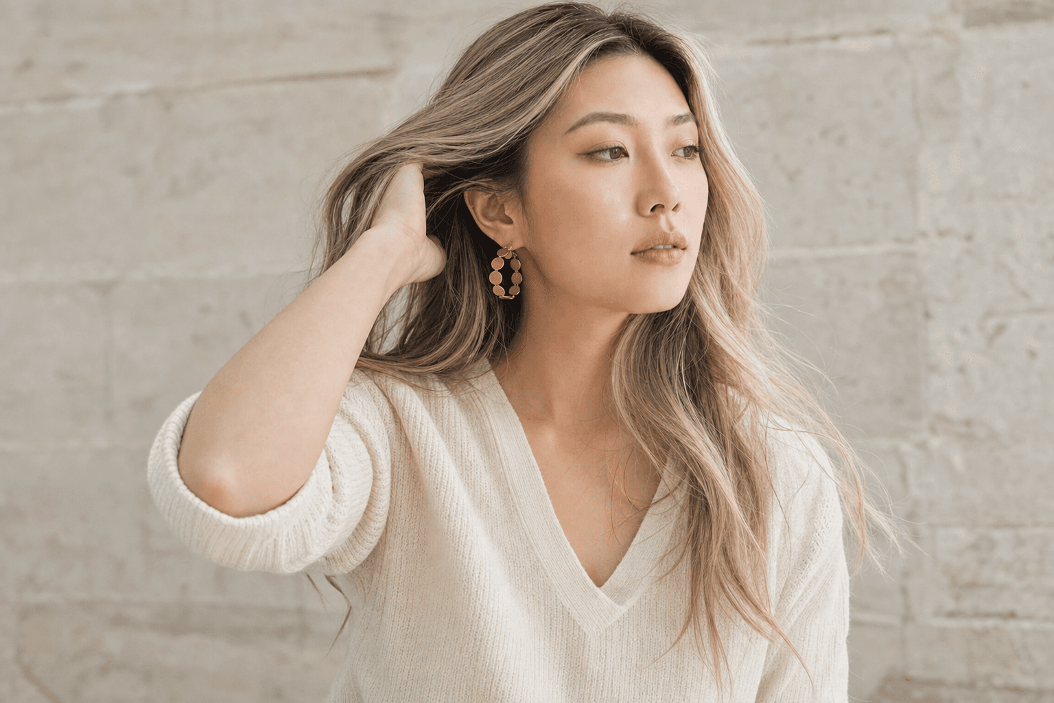 Orbit Hoops half hidden by loose hair, outdoors in daylight